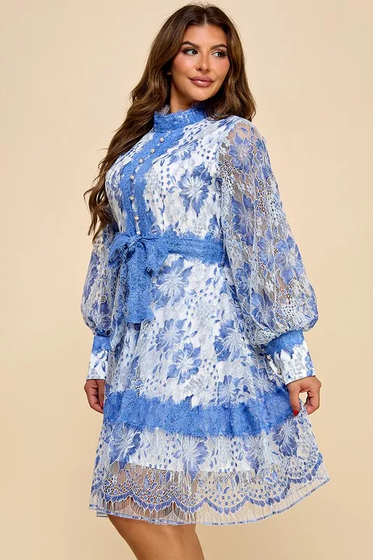 A Short Blue Lace Dress With Blue And White Lace Trim