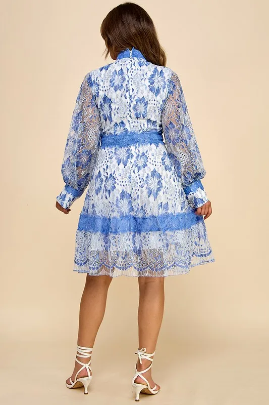 A Short Blue Lace Dress With Blue And White Lace Trim