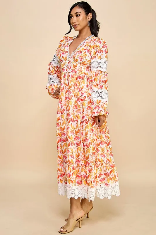 A Long Dress For Women Featuring Vibrant Floral Prints, Cutouts, And Lace Trim.