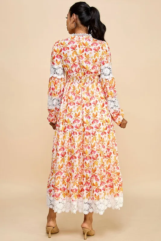 A Long Dress For Women Featuring Vibrant Floral Prints, Cutouts, And Lace Trim.