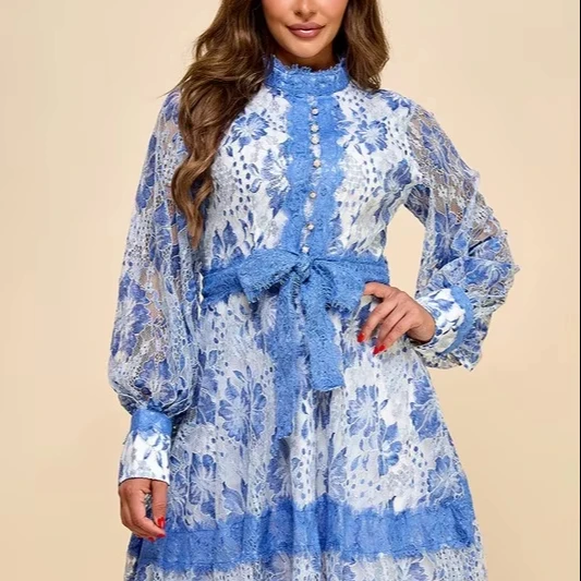 A Short Blue Lace Dress With Blue And White Lace Trim